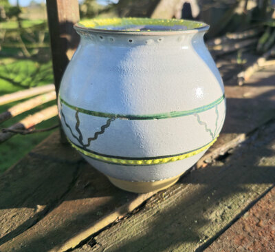 Bote de la grasa rallas verde y amarillo de Faro